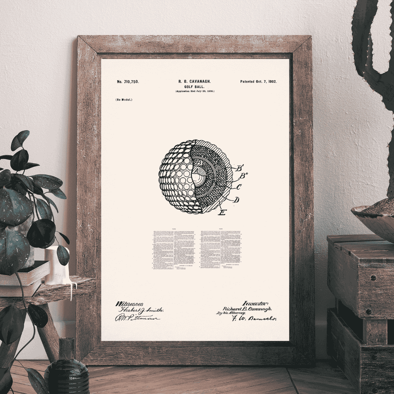 Framed vintage patent print on a wall with decorative elements golf gift ideas